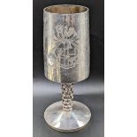 A Modernist silver goblet, planished finish, pierced stem, crest to one side, engraving to the