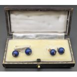 A pair of Lapis Lazuli and diamond cufflinks, mounted on yellow gold