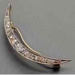 A Diamond moon brooch, mounted on gold and platinum, largest diamond .10cts, 5g, L.4.5cm