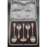 A George Jensen silver set of 4 spoons and a ladle