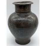 A Middle Eastern Islamic inlaid copper jar depicting inscriptions, H.18cm