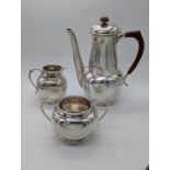 A Liberty & Co. silver Arts and Crafts 3 piece tea set, planished finish, hallmarked Birmingham,