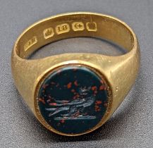 An 18ct gold signet seal ring, bloodstone seal depicting bird, 7g, size O