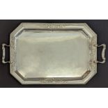 A very large silver serving tray, Gothic style appliques, bat head handle terminals, hallmarked