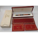 A Must de Cartier lacquered ball point pen with box and papers