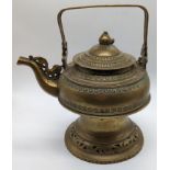 A Tibetan brass teapot, H.22.5cm