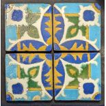 Four Persian 18th or 19th century cuerda-secca tiles, 31cm x 31cm