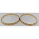A pair of 18ct gold bangles, both marked, possibly Moroccan or French, test as 18ct, 34g, diameter