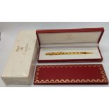 A must de Cartier gold plated ball point ben with box and papers