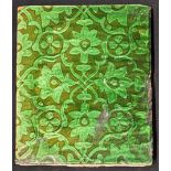 A 19th century Indian green glazed pottery tile, 26.5cm x 21.5cm
