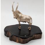A Patrick Mavros silver ibex sculpture, inlaid signature, raised on wooden base, H.6.5cm