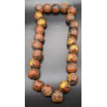 A Large Thai Terracotta bead necklace with gold leaf, diameter of each bead 3cm,