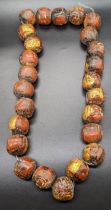 A Large Thai Terracotta bead necklace with gold leaf, diameter of each bead 3cm,