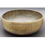 A 15th century Mamluk brass bowl with engraved Islamic calligraphy, probably Yemen, D.15cm