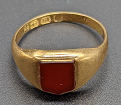 An 18ct gold ring signet ring with vacant Carnelian shield, 2.5g