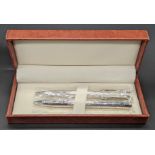 A pair of contemporary silver ball point pens, London hallmarks, cased