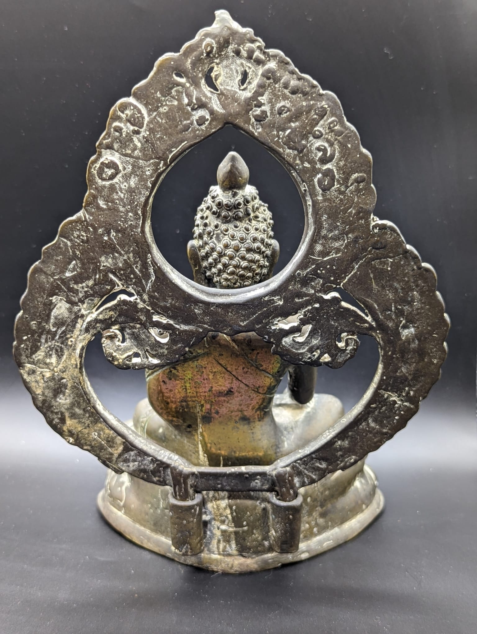 An 18th or 19th century Tibetan or Nepalese brass Buddha, traces of gilding to the rear, H.23cm - Image 2 of 3