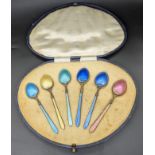 A cased set of 6 early 20th century silver and coloured enameled teaspoons, Birmingham hallmarks,
