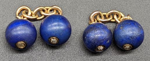 A pair of Lapis Lazuli and diamond cufflinks, mounted on yellow gold