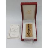 A must de Cartier gold plated lighter, no.89920, with box and papers