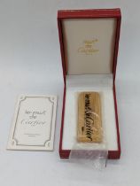 A must de Cartier gold plated lighter, no.89920, with box and papers