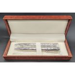 A pair of contemporary silver ball point pens, London hallmarks, cased