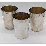 Three Asprey silver beakers, hallmarked Birmingham, 1921, 375g, H.9cm