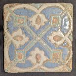A 17th or 18th century Persian or central Asian Safavid cuerda-secca tile, 20cm x 20cm