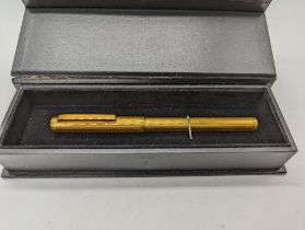 A Dunhill gold plated fountain pen, 14ct nib
