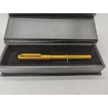 A Dunhill gold plated fountain pen, 14ct nib