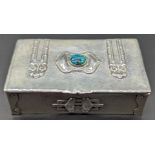 An Arts and Crafts silver box, mounted with central stone and heart appliques, hallmarked