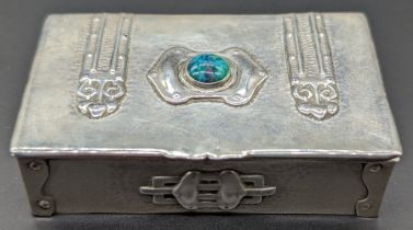 An Arts and Crafts silver box, mounted with central stone and heart appliques, hallmarked