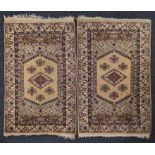 A pair of Antolian wool rugs, green, beige and red, Kolua, circa 1920s, 140cm x 95