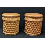 A pair of terracotta stools with shell style decor, H.36cm