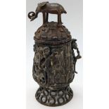 A 19th century West African bronze box, finial in the form of an elephant, the body decorated with
