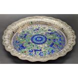 An 18th or 19th century Indian Lucknow enamelled silver dish with blue and green enamelled flora and