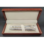 A pair of contemporary silver ball point pens, London hallmarks, cased