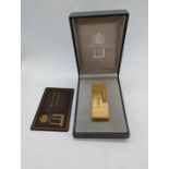 A Dunhill gold plated lighter with case