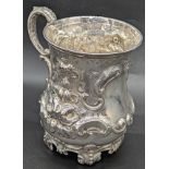 A Victorian silver mug, repousse embossed, vacant cartouche, hallmarked Sheffield, 1859, maker