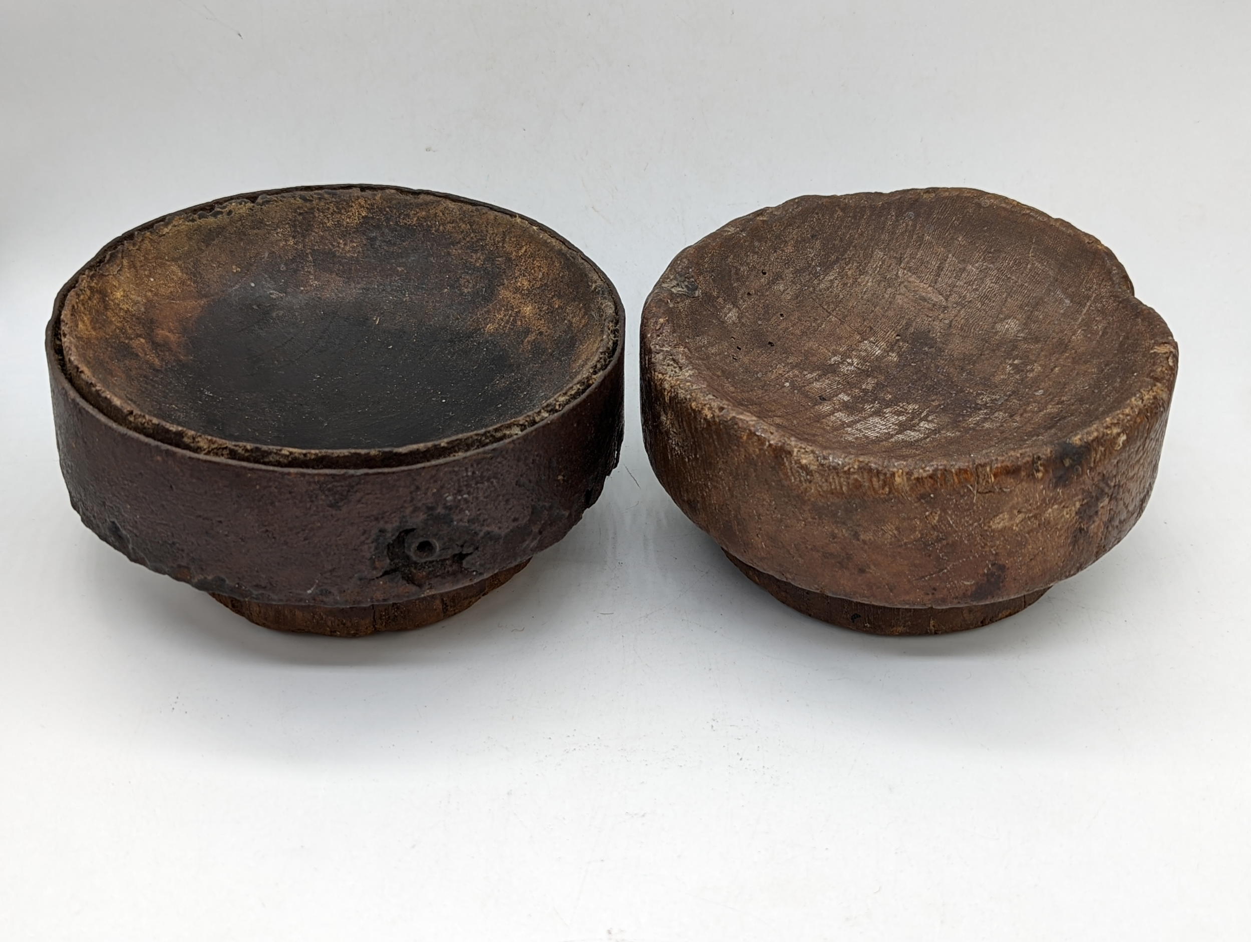 A pair of 18th century carved wooden mortars, D.14cm