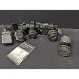 A collection of Nikon Cameras and lenses: A Nikon F90, no.2008846 with Nikkor 28mm f/3.5 lens, a