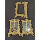 An Art Nouveau brass photo frame together with a pair of other brass frames, H.21.5cm (largest)