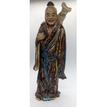 A 19th century Chinese high fire clay figure, H.32cm