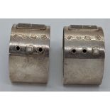 An unusual pair of Modernist design custom made silver napkin rings, applied decor, hallmarked