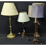 A collection of four table lamps