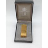 A Dunhill gold plated lighter with case