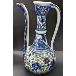 A 19th century Persian Qajar glazed potter ewer, H.28cm