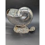 A silver plated nautilus shell container