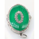 An early 20th century silver and green guilloche enamel pill box, London import hallmarks, maker C&C