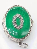An early 20th century silver and green guilloche enamel pill box, London import hallmarks, maker C&C